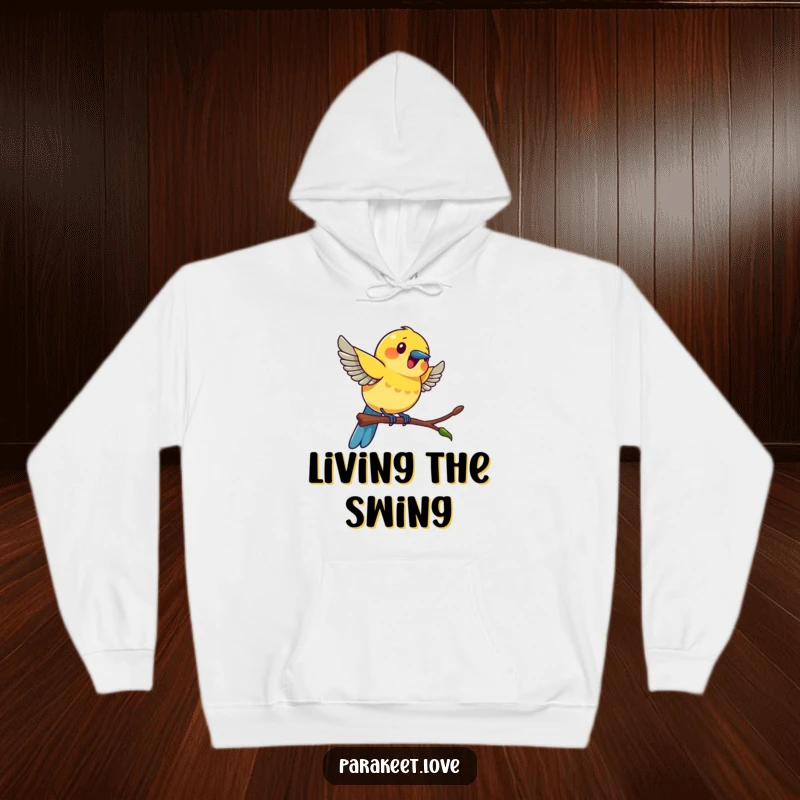 Funny colorful bird hoodie illustrating a bird in mid-swing on a tiny perch, radiating excitement and fun.